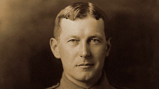 Historical portrait of John McCrae in military uniform circa 1914.